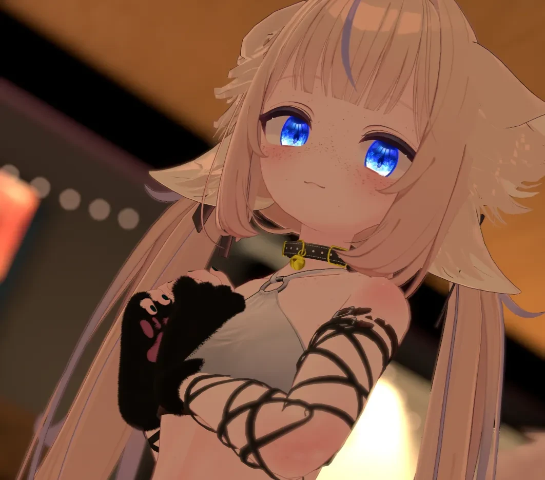 Elsyian's blonde avatar smiling for the camera in VRChat